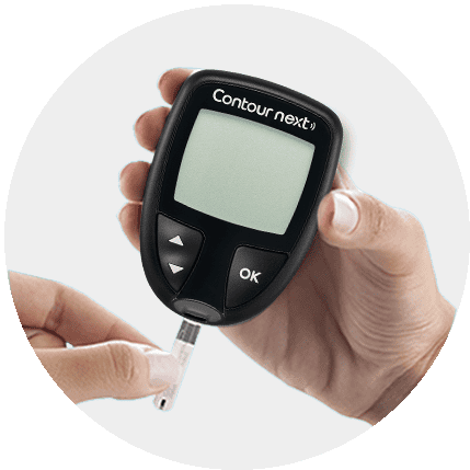 user inserting a strip in a meter